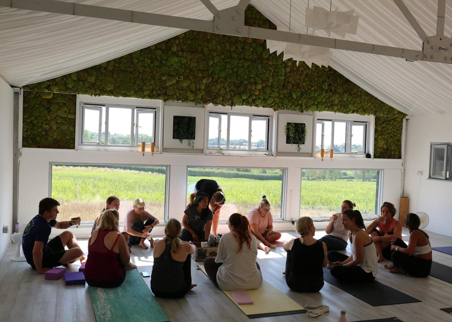 Group sitting together after yoga class at Thaxted Wellness Hub, Essex